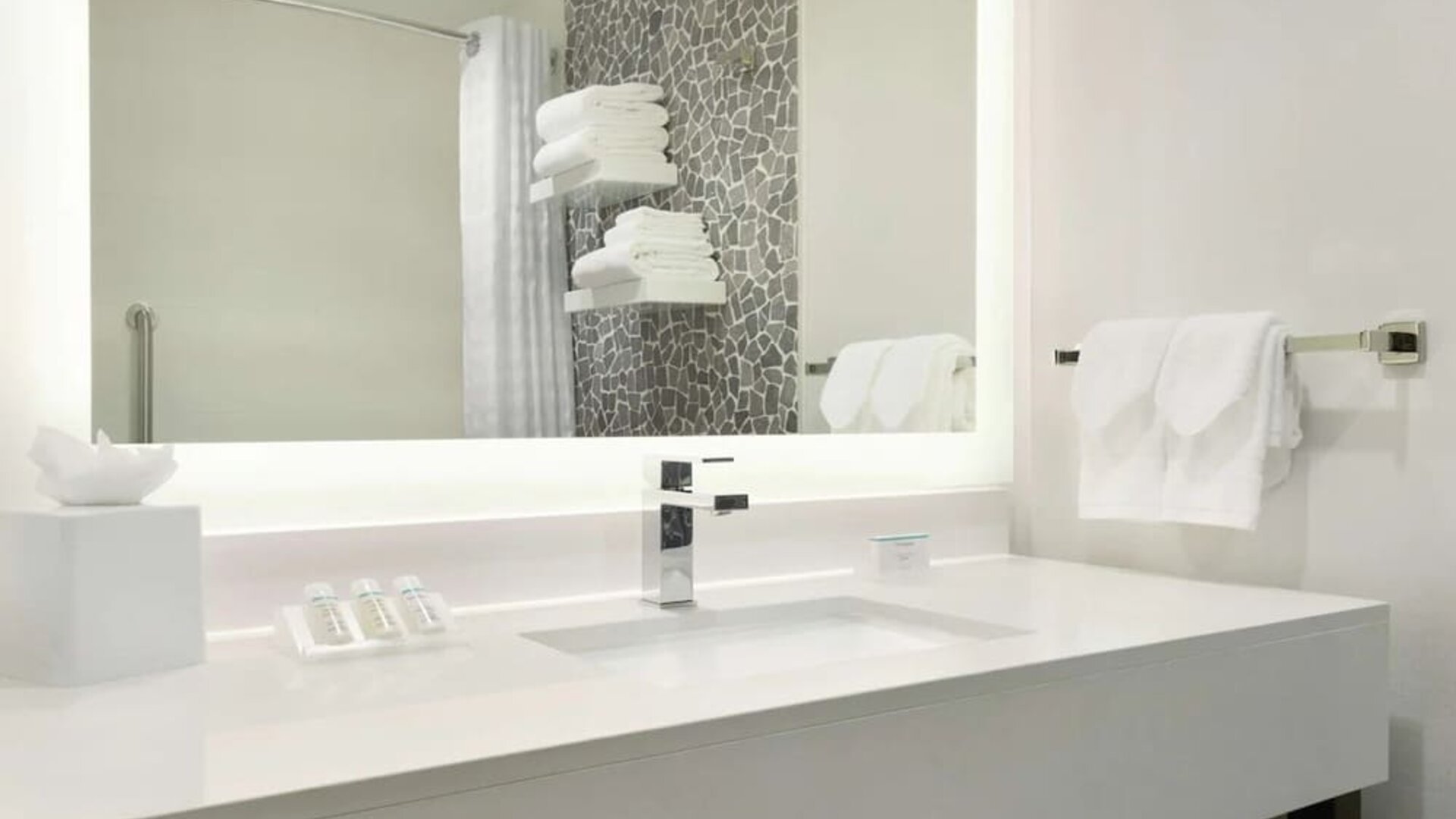 Guest bathroom with shower at Hilton Garden Inn Calgary Downtown.