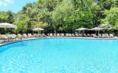 Luxurious outdoor pool with pool chairs at Hilton Short Hills.