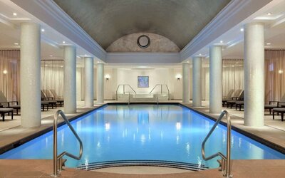 Stunning indoor pool with pool chairs at Hilton Short Hills.