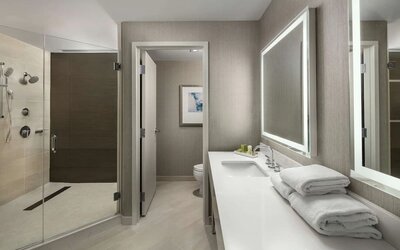 Guest bathroom with shower at Hilton Boston Logan Airport.