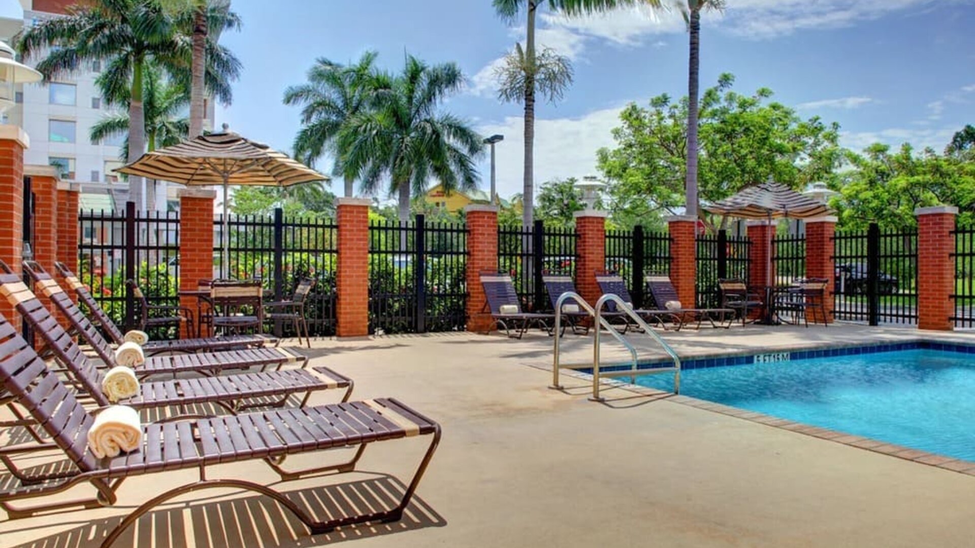 Sun loungers beside the pool at Hyatt PLACE Fort Lauderdale Airport - South & Cruise Port.