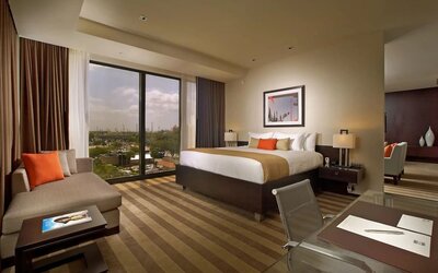 Day use room with work desk and sofa at EB Hotel Miami.