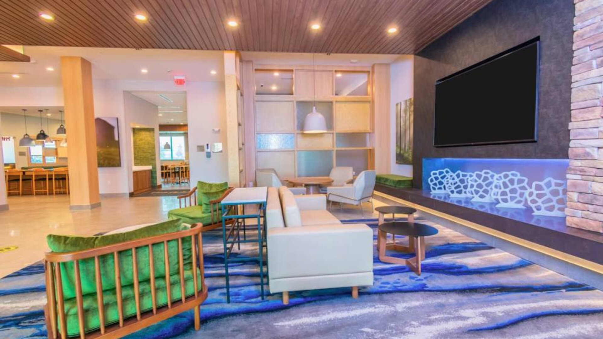 Lobby and coworking lounge at Fairfield Inn & Suites By Marriott Houston League City.