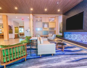 Lobby and coworking lounge at Fairfield Inn & Suites By Marriott Houston League City.