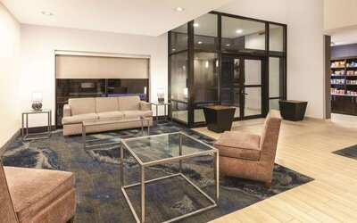 Lobby and coworking lounge at La Quinta Inn & Suites By Wyndham Philadelphia Airport.