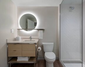 Guest bathroom with shower at TownePlace Suites Nashville Midtown.