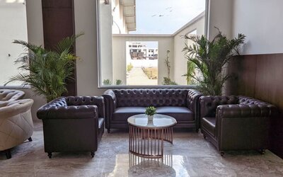 Lobby and coworking space at Mayur Belgaum Presidency Hotel & Spa.