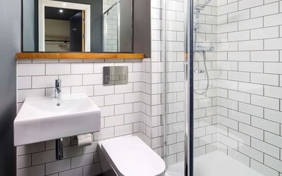 Guest bathroom with shower at Ibis Budget Sheffield Centre St Marys Gate.