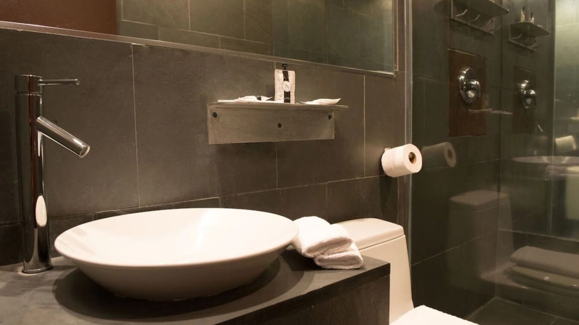 Guest bathroom with shower at Hotel Chelsea, A South Beach Group Hotel.