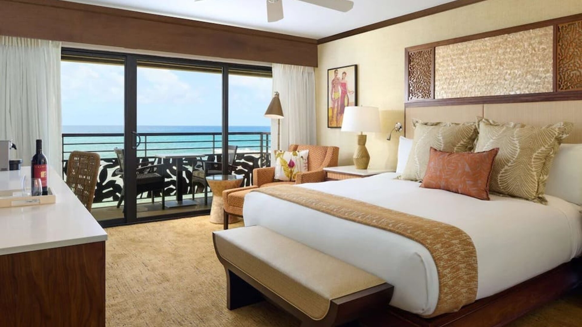 King bed with outdoor terrace at Ko'a Kea Resort On Po`ipu Beach.