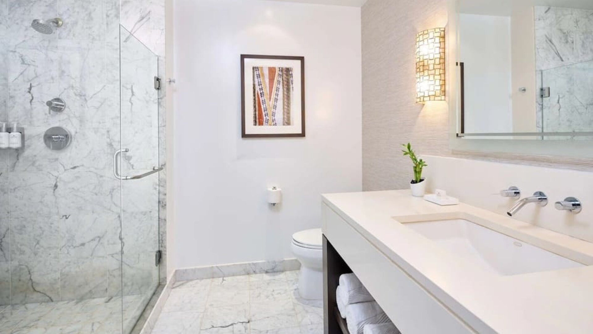 Bathroom with shower at Ko'a Kea Resort On Po`ipu Beach.
