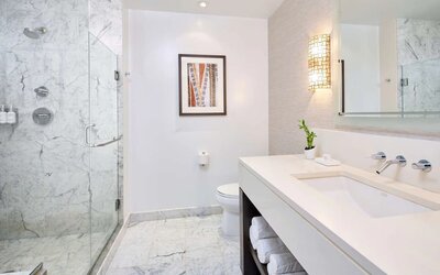 Bathroom with shower at Ko'a Kea Resort On Po`ipu Beach.