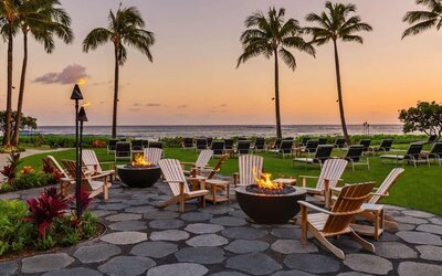 Garden with seating area ideal for coworking at Ko'a Kea Resort On Po`ipu Beach.
