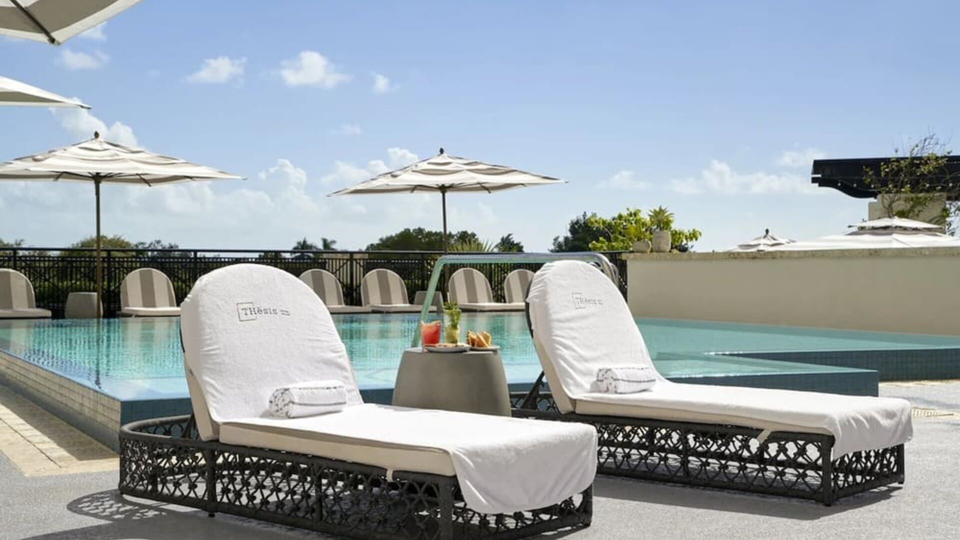 Stunning outdoor pool with sun beds at THesis Hotel Miami.