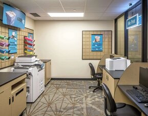 Business center with computers, printers and ergonomic chairs at Hilton Minneapolis.