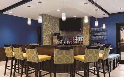 Hotel bar with lounge seating at Hilton Garden Inn Houston NW/Willowbrook.