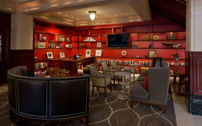 The hotel’s lobby lounge has extensive reading material, comfy chair and sofa seating, and numerous coffee tables.
