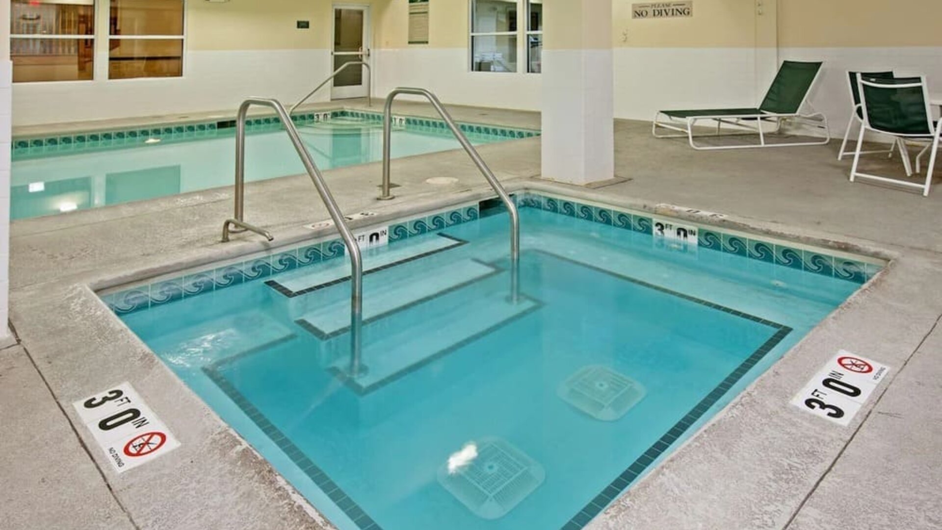 Relaxing indoor pool area at Country Inn & Suites By Radisson, Chicago O'Hare South.