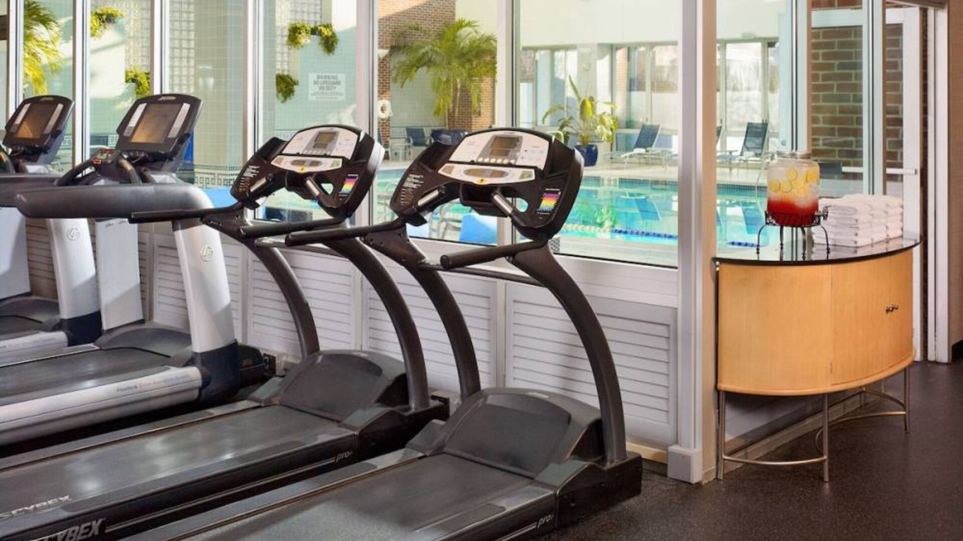 The hotel fitness center has numerous exercise machines and is adjacent to the indoor pool.