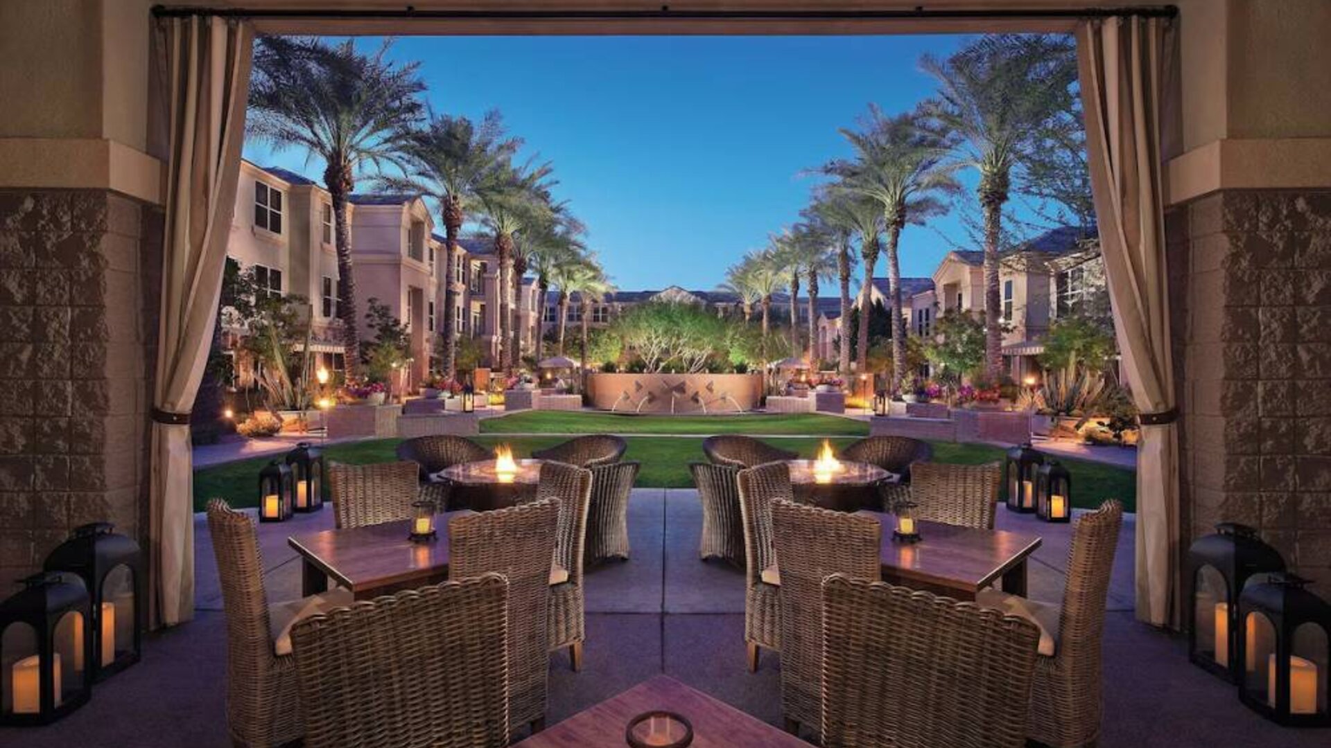 Sonesta Suites Scottsdale Gainey Ranch’s fire pits are surrounded by comfy chairs, with more tables and chairs, and candle-style lights, nearby for outdoor socializing.