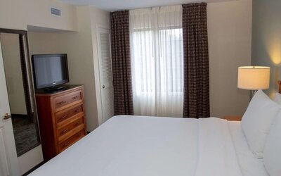 Sonesta ES Suites San Antonio Northwest - Medical Center guest room, furnished with double bed and widescreen television.