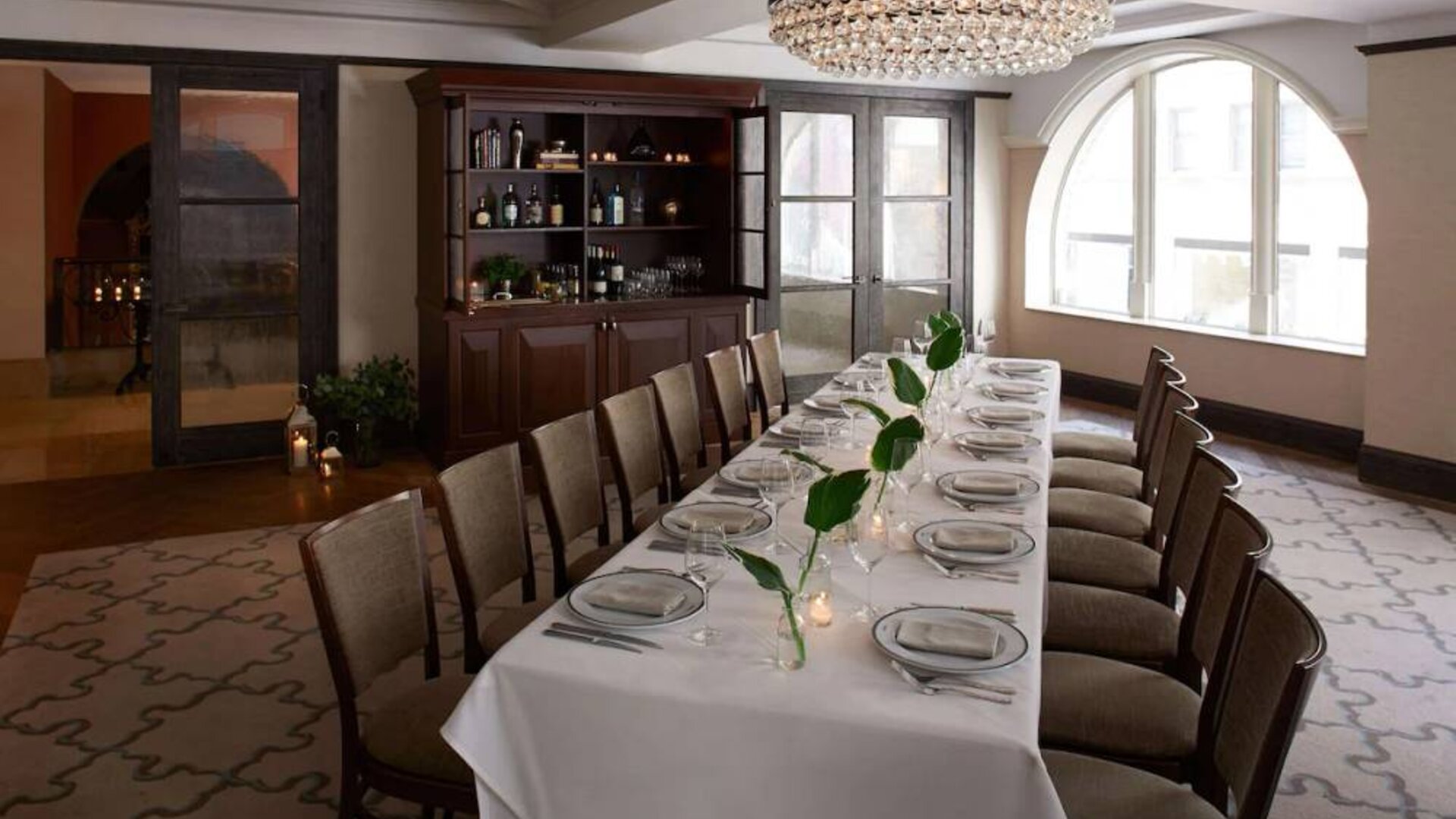 The Benjamin Royal Sonesta New York’s corner room offers white tablecloth dining in a chic setting, with plenty of natural light and a glittering chandelier.