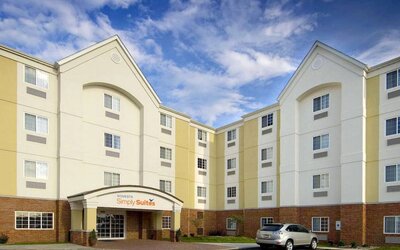 The hotel’s exterior has parking close to the front door, which features potted plants and has the Sonest Simply Suites name above it.