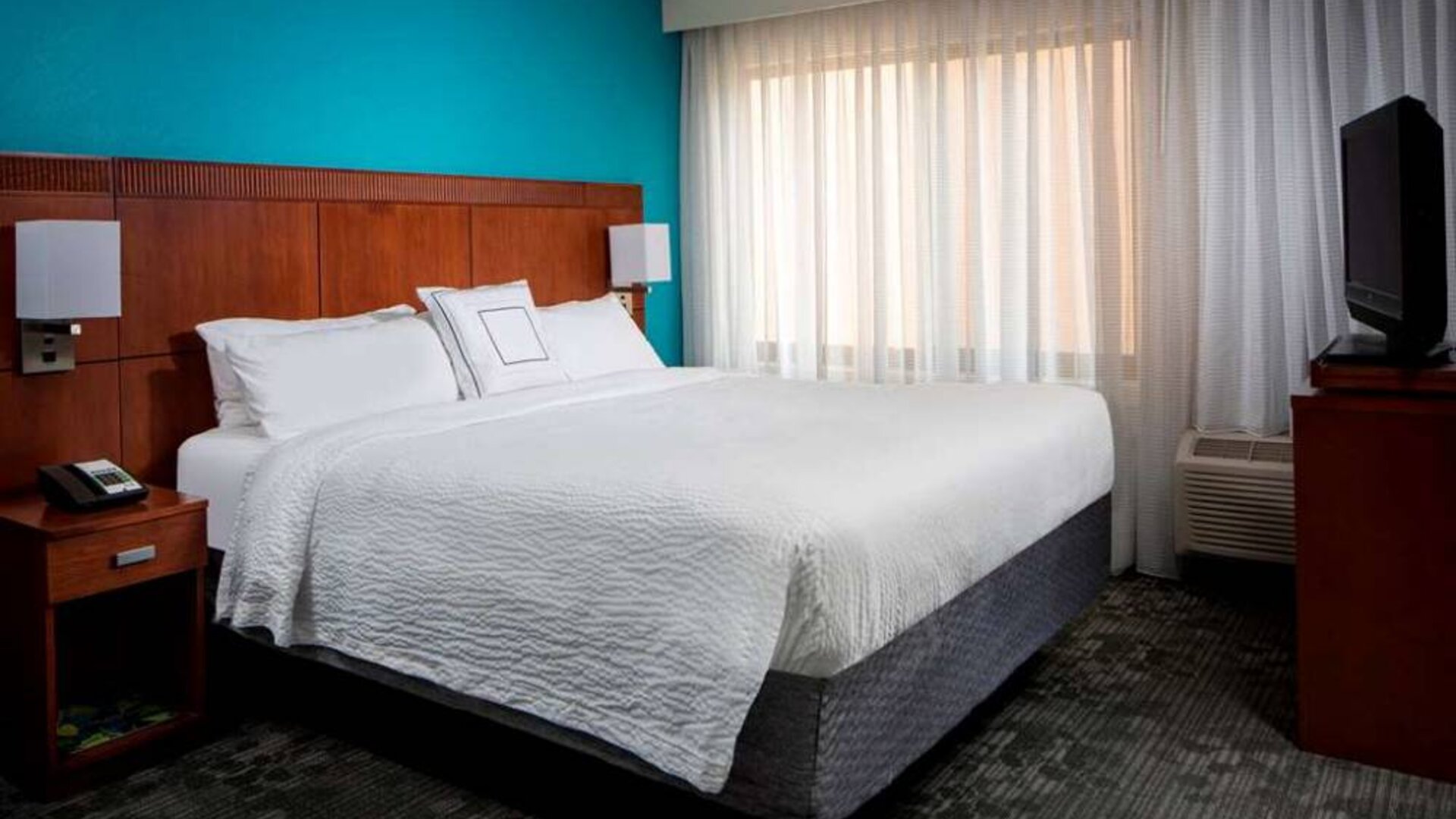 Double bed guest room in Sonesta Select Boca Raton, featuring a large window and a TV.