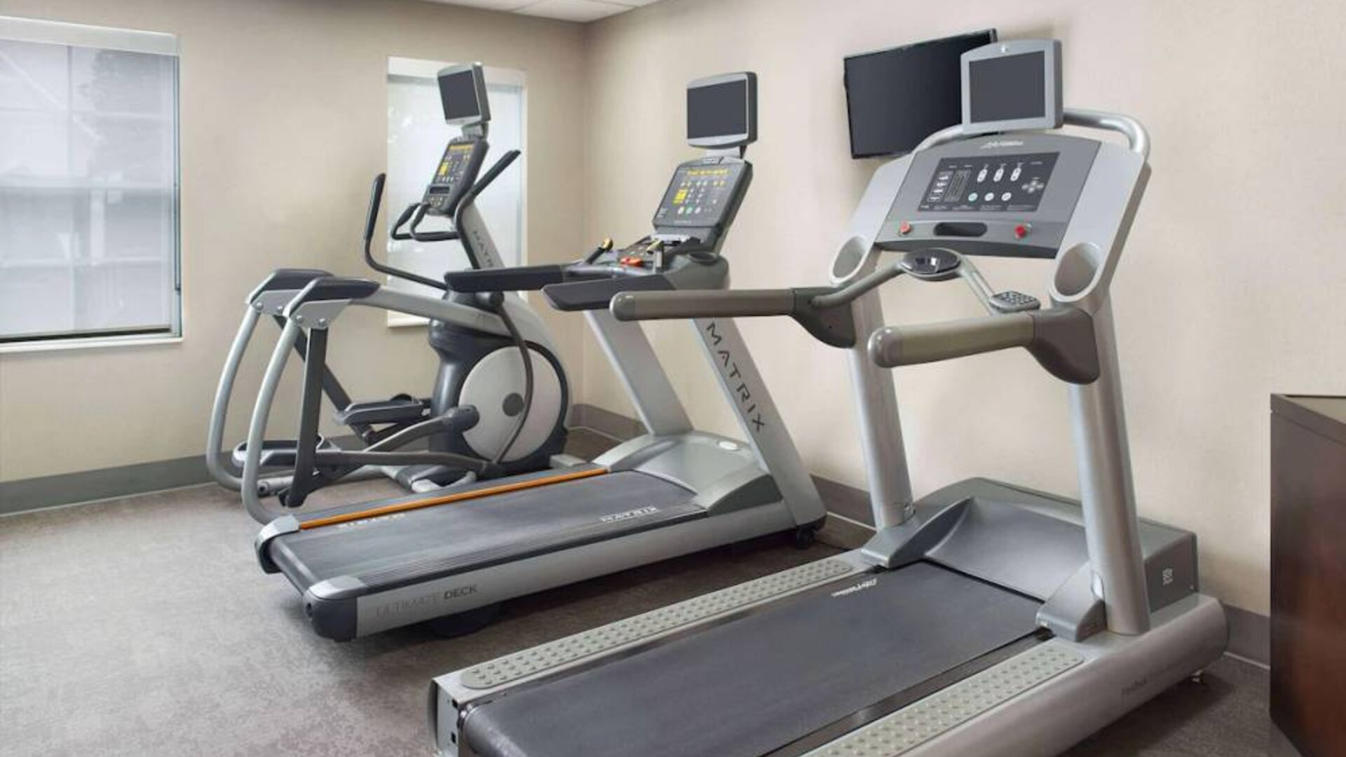 The hotel’s fitness center is equipped with various types of exercise machine, and has a wall-mounted television.