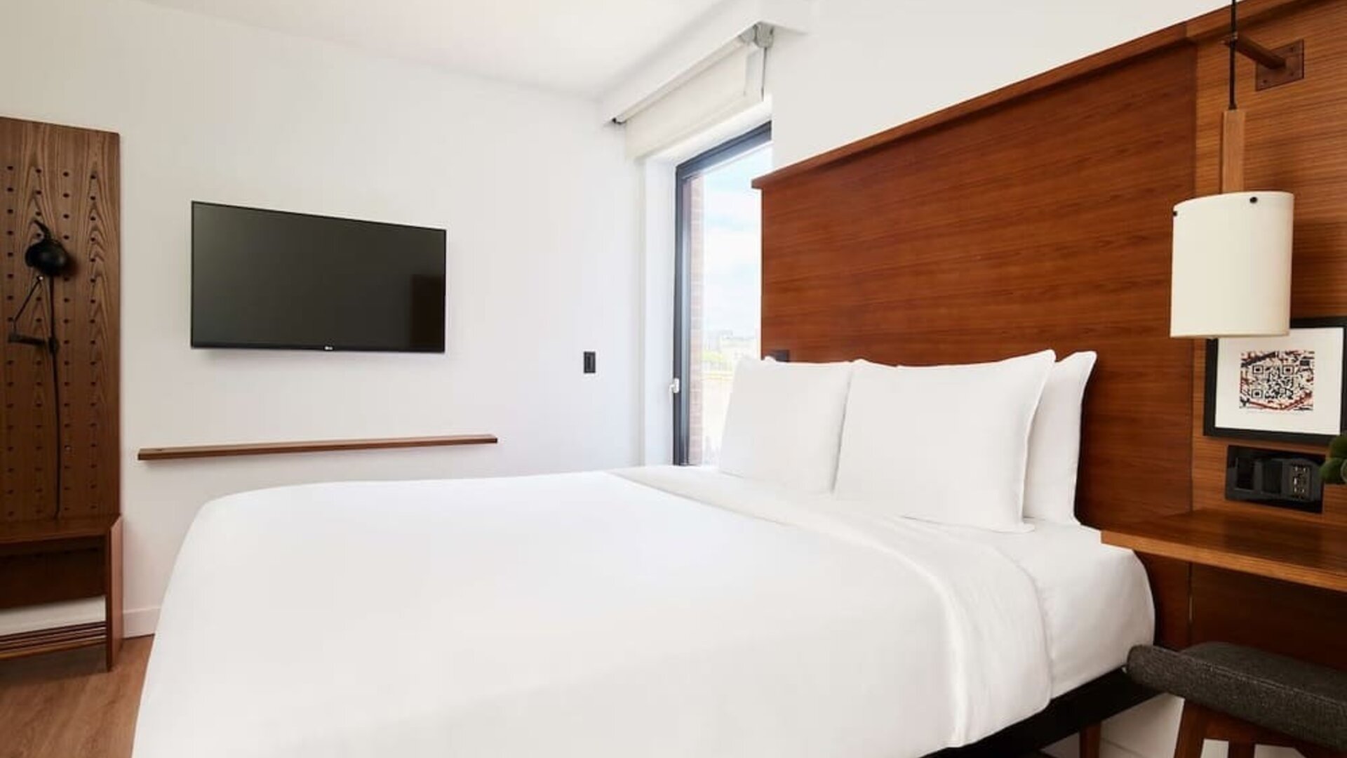 King bed with TV at Arlo SoHo.