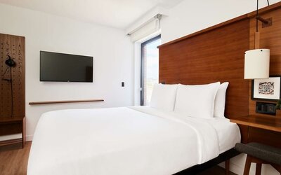 King bed with TV at Arlo SoHo.