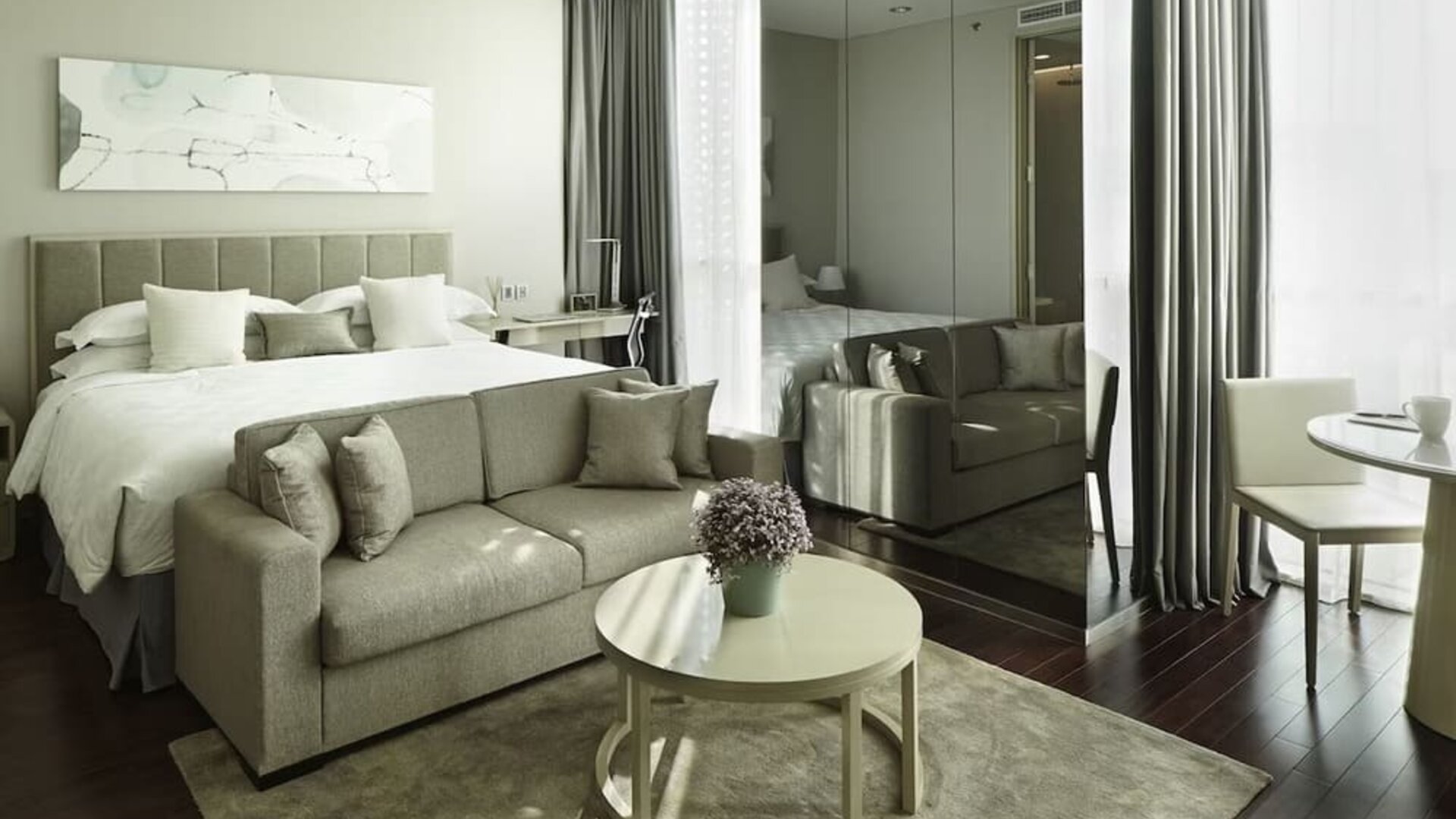 Spacious king room with lounge at Fraser Residence Menteng Jakarta.