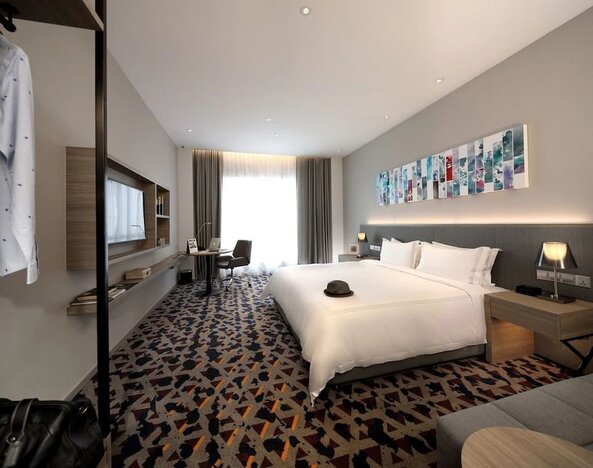 Delux king room with TV and natural light at Capri By Fraser Johor Bahru.