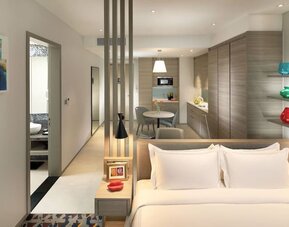 Spacious king room with lounge area at Capri By Fraser Johor Bahru.