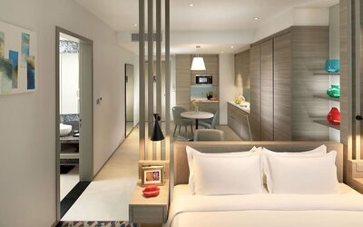 Spacious king room with lounge area at Capri By Fraser Johor Bahru.