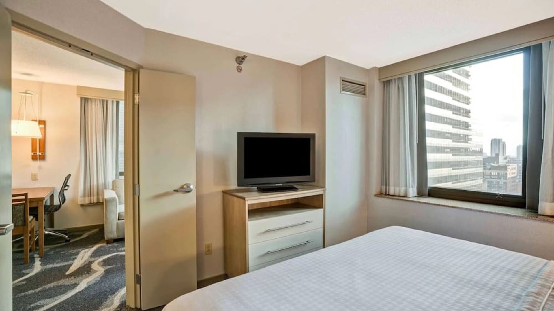 Day room with TV at Homewood Suites By Hilton Chicago-Downtown.