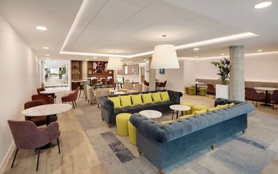 Coworking area and lounge at Hampton By Hilton London Stansted Airport.