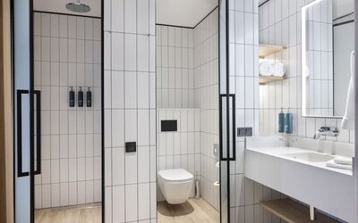 Guest bathroom with shower at Hilton Garden Inn Tbilisi Riverview.