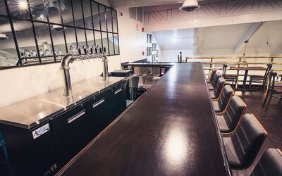 Bar and coworking space at EnVision Hotel Miami International Airport.