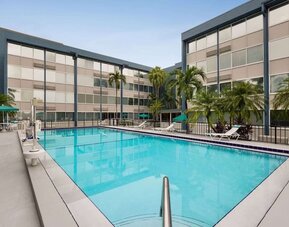 Beautiful outdoor pool at EnVision Hotel Miami International Airport.