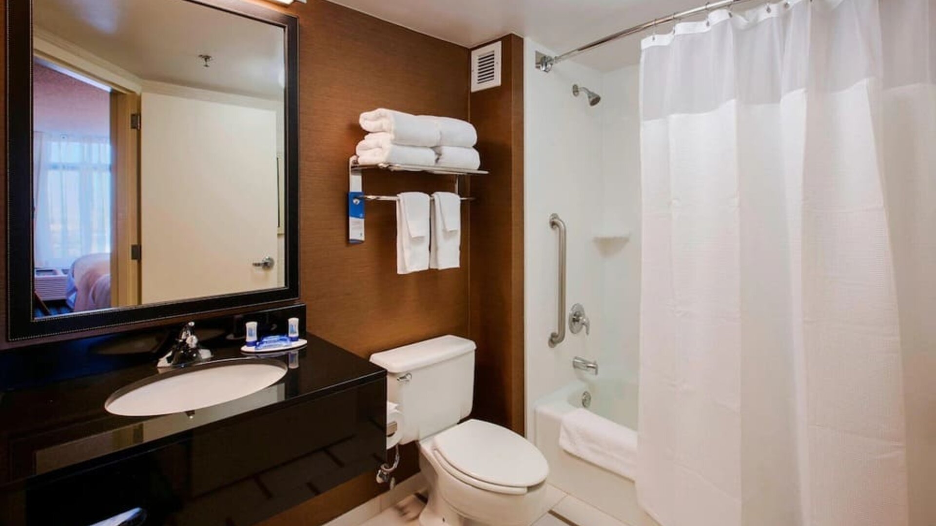 Guest bathroom with shower and bath at Fairfield Inn East Rutherford Meadowlands.