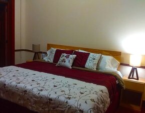 Comfortable king room at Casa María Hostal.