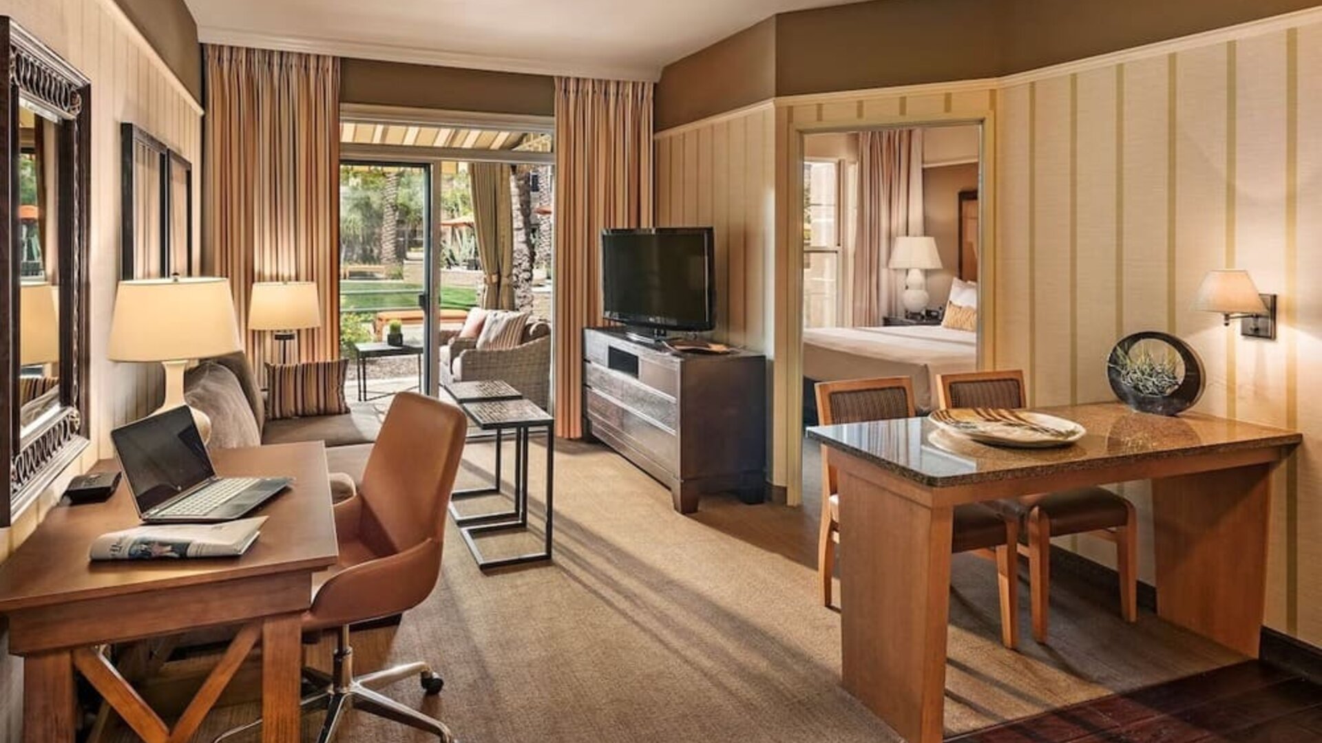 Spacious day room with work station at Sonesta Suites Scottsdale Gainey Ranch.