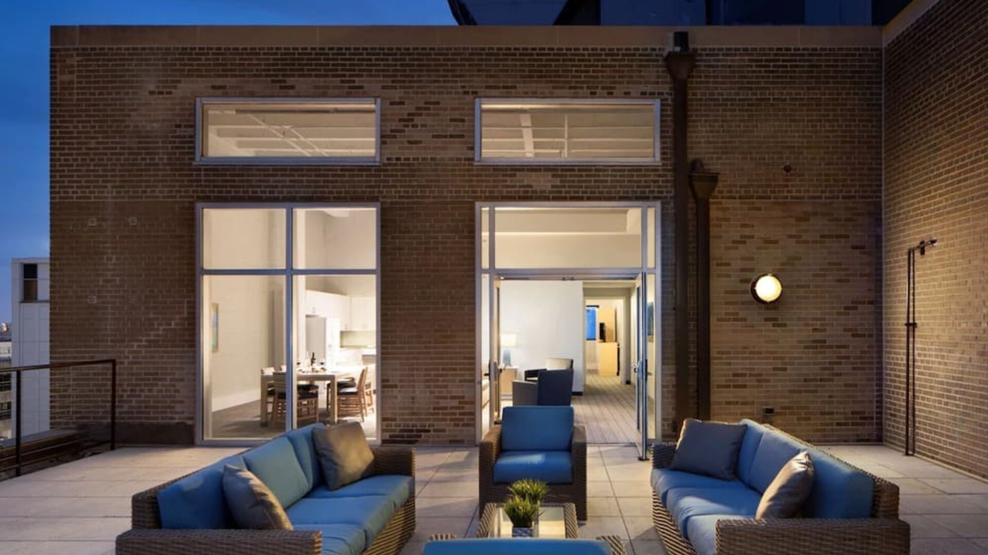 Outdoor lounge and coworking space at Sonesta ES Suites New Orleans.