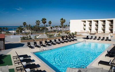 Lovely outdoor pool and pool chairs at Sonesta Redondo Beach & Marina.