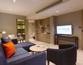 King room with lounge area at Modena By Fraser Buriram.