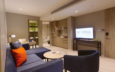 King room with lounge area at Modena By Fraser Buriram.