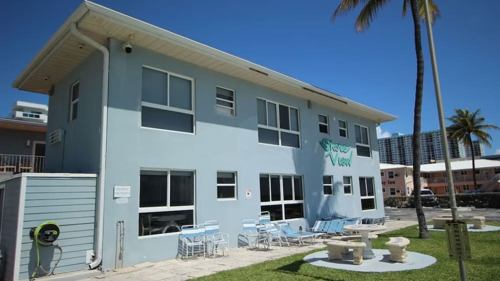 Hotel with lounge chairs at Shore View Hotel.