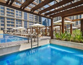 Three outdoor pools at Hilton Dubai Al Habtoor City.