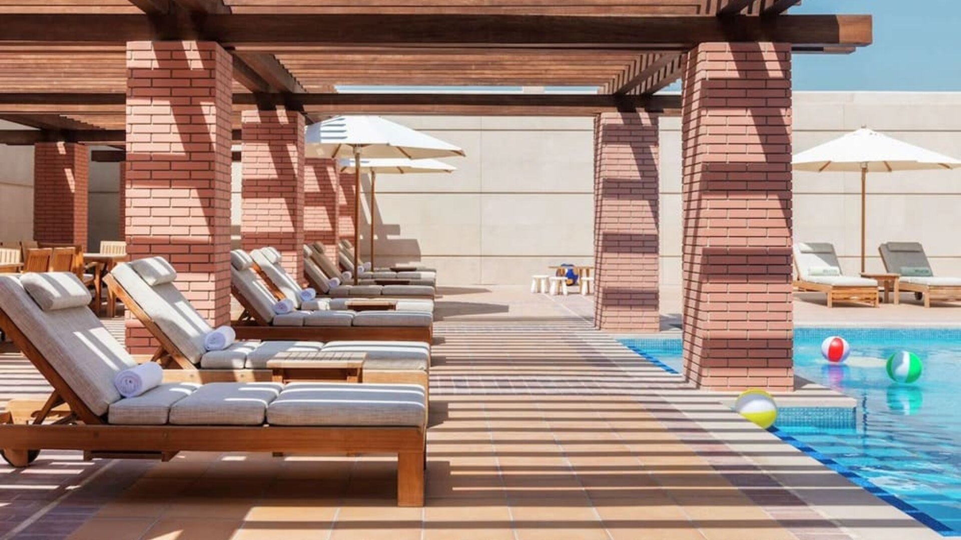 Outdoor lounge chairs at Hilton Dubai Al Habtoor City.